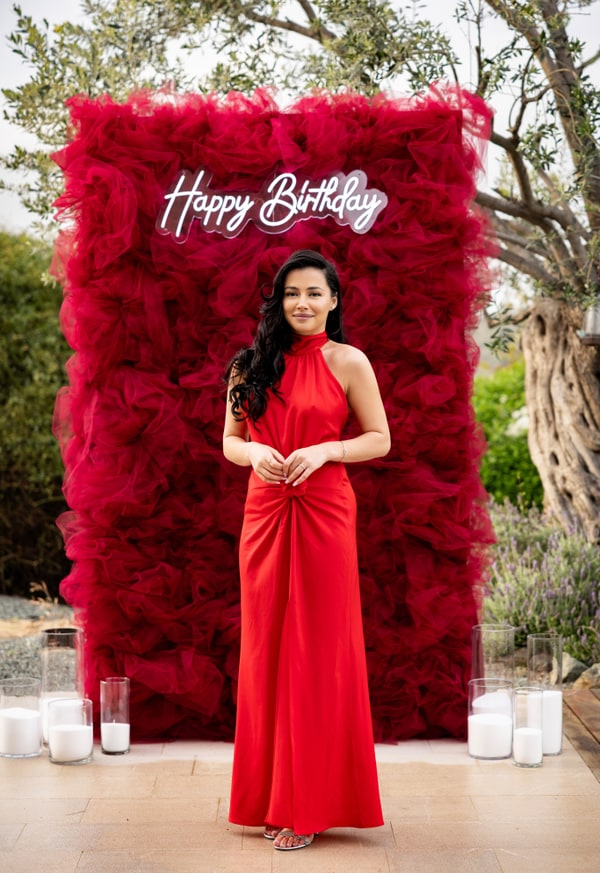 A birthday portrait of a woman in an evening dress