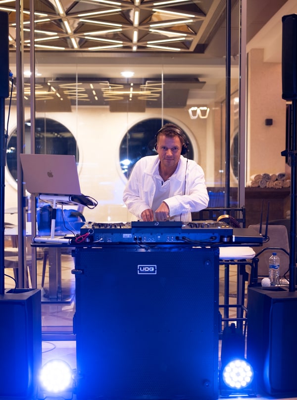 A DJ performing at the mixing desk