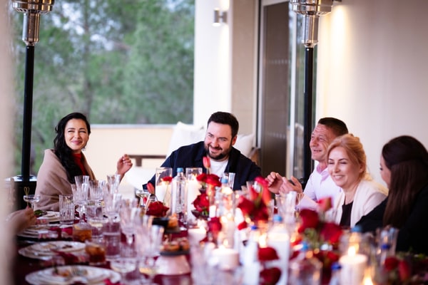 Guests at a birthday celebration with red décor