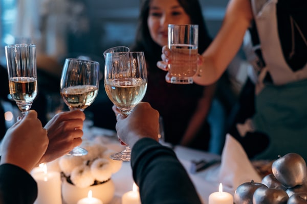 Guests greeting, toasting and celebrating together