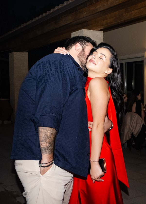 Guests embracing during the birthday celebration