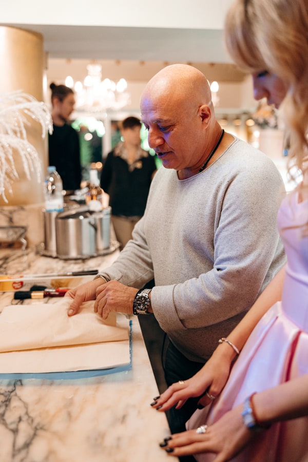 Guests making fresh pasta together in a kitchen