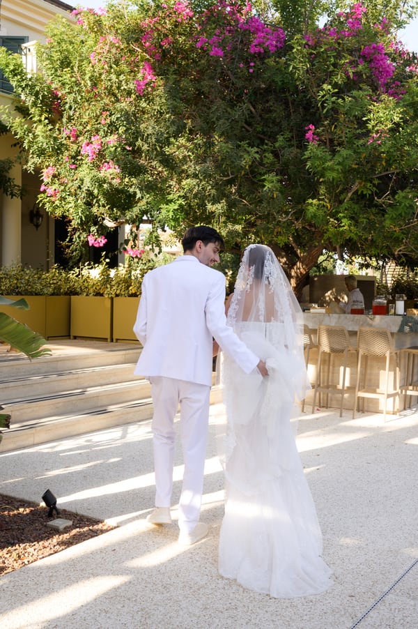The bride and groom embracing in the garden