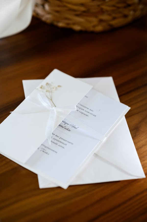 Wedding stationery arranged beside the bouquet
