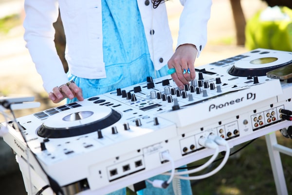 White DJ decks and mixing controls