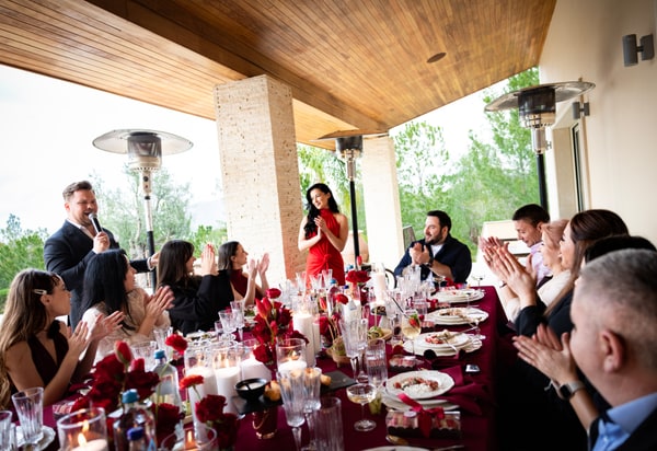 Guests at a birthday celebration with red décor