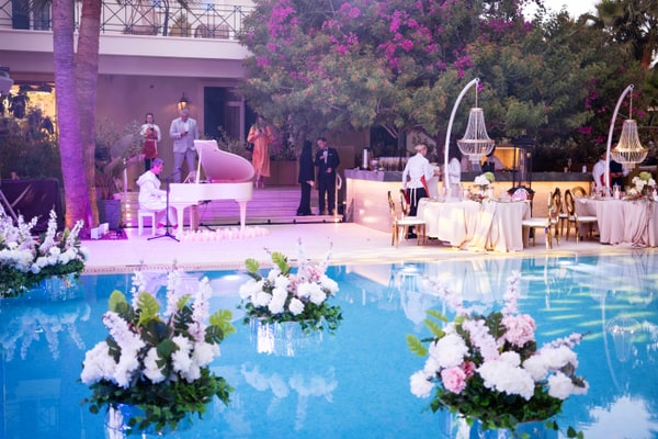 Floral arrangements floating in the pool