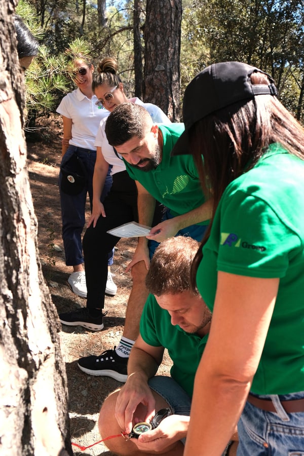 Participants working together on an outdoor team activity
