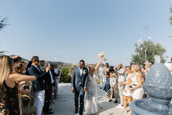 Guests showering Nathalie and Joël with confetti after the ceremony