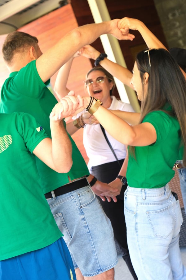 Participants gathering in green and white shirts