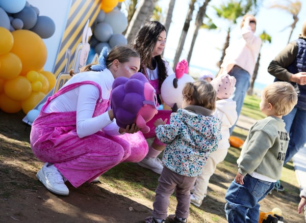 Entertainers playing with children at the birthday party