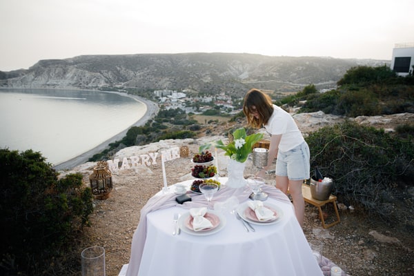 Preparing a table for two above the sea