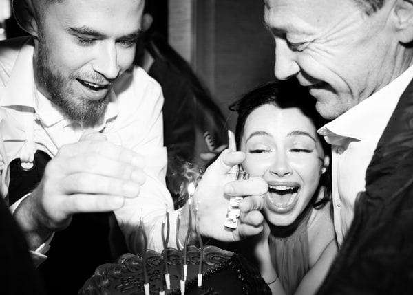Guests gathered around the birthday cake