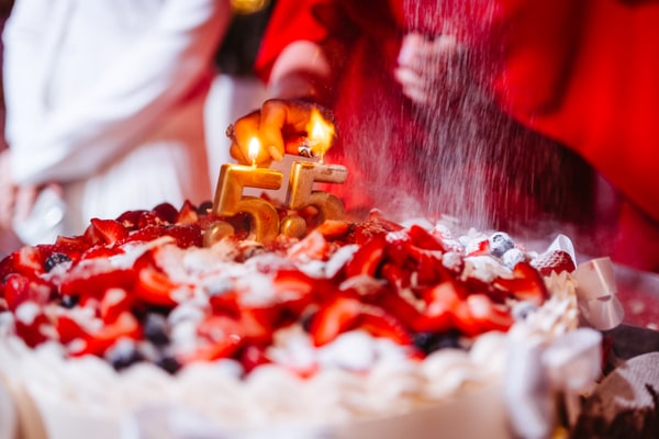 Celebration cakes with candles and decorative details