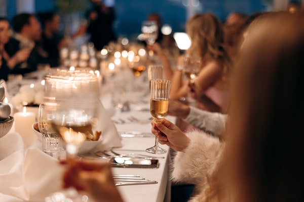Guests greeting, toasting and celebrating together