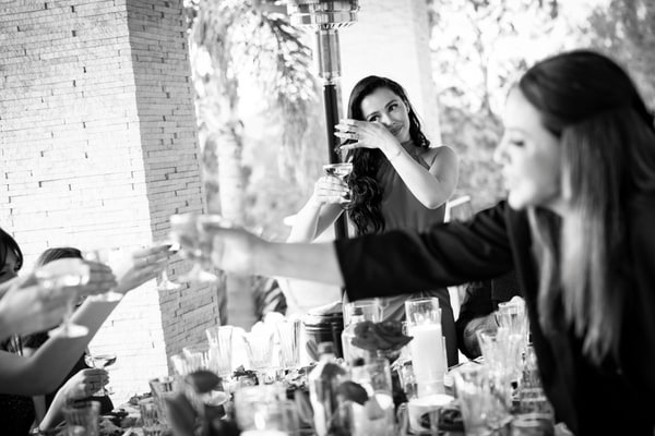 Guests at a birthday celebration with red décor