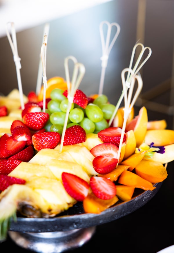 Small bites and fruit arranged for the birthday buffet