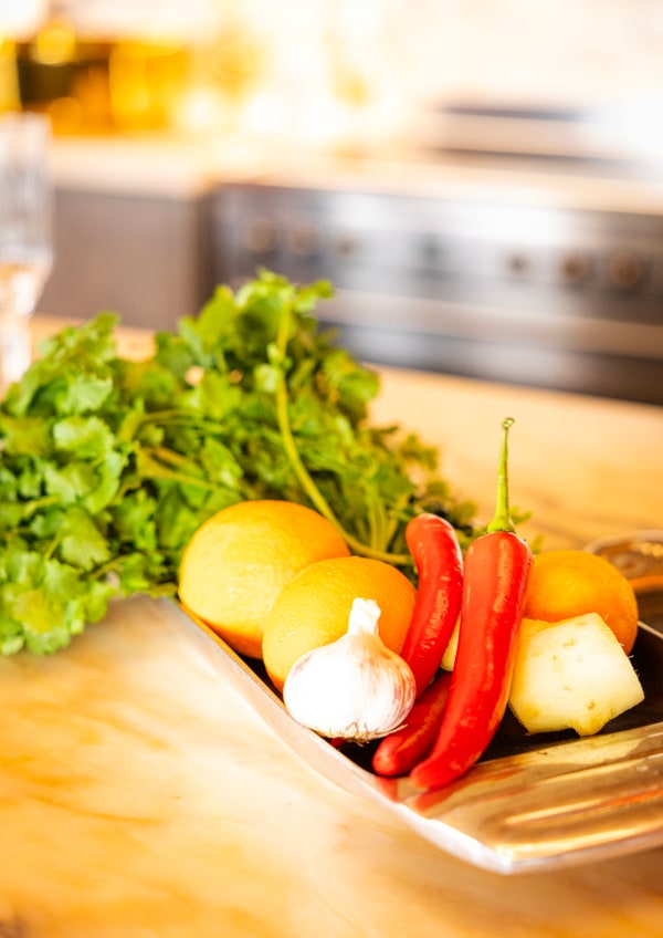 Peppers and leafy greens arranged for food preparation