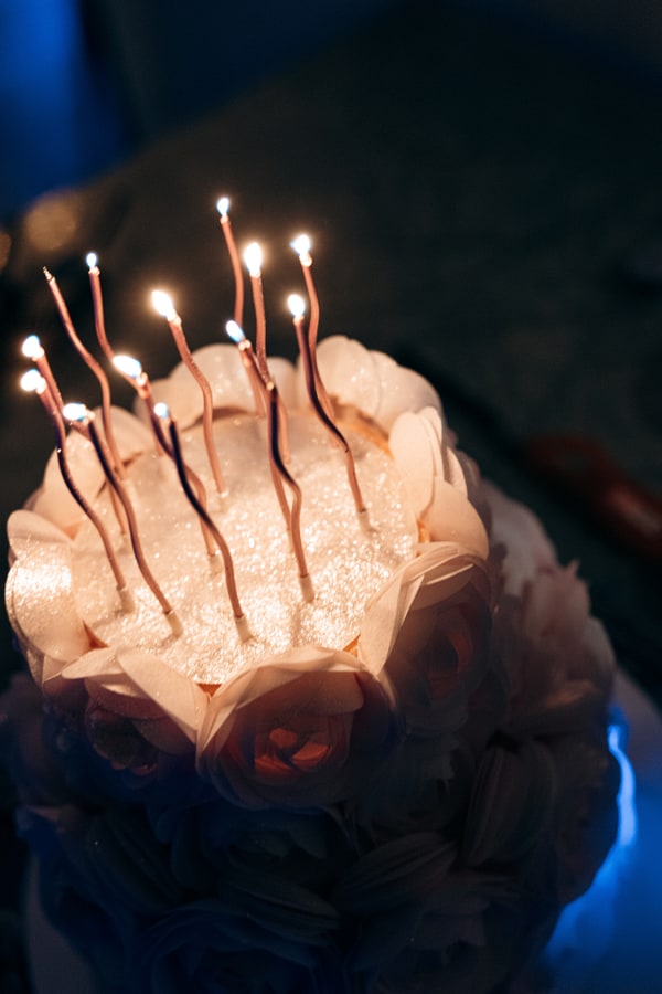 Lit candles on a birthday cake