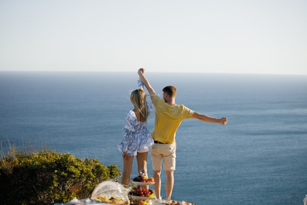A couple dancing and embracing beside the sea