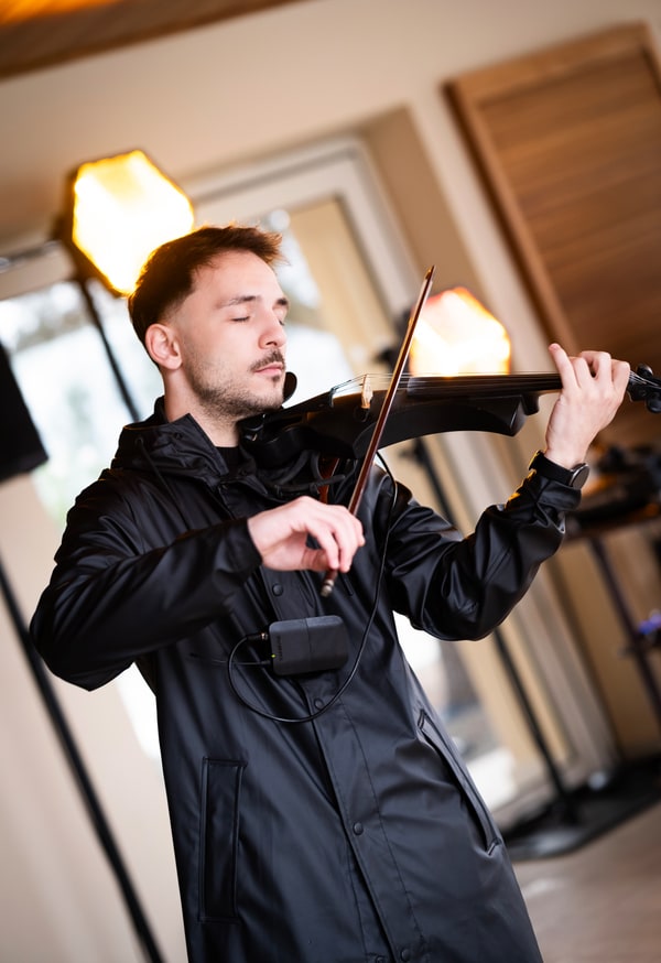 A violinist performing indoors