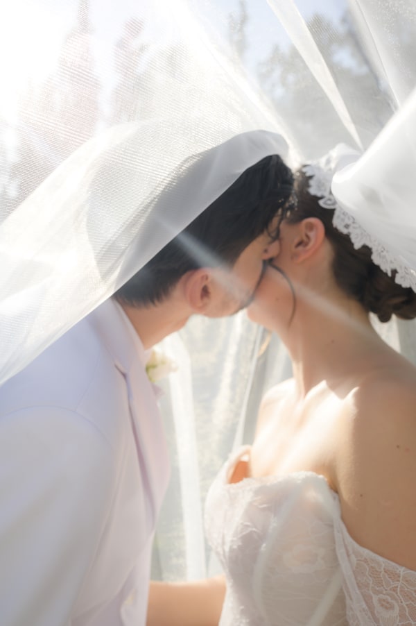 The bride and groom embracing in the garden