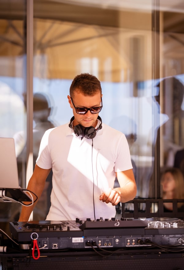 A DJ performing at the mixing desk
