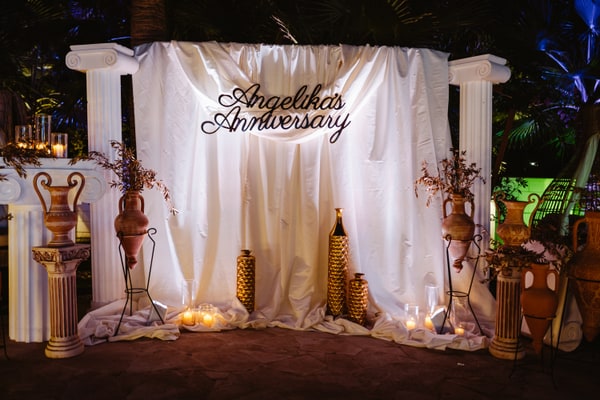 A draped anniversary backdrop in the garden
