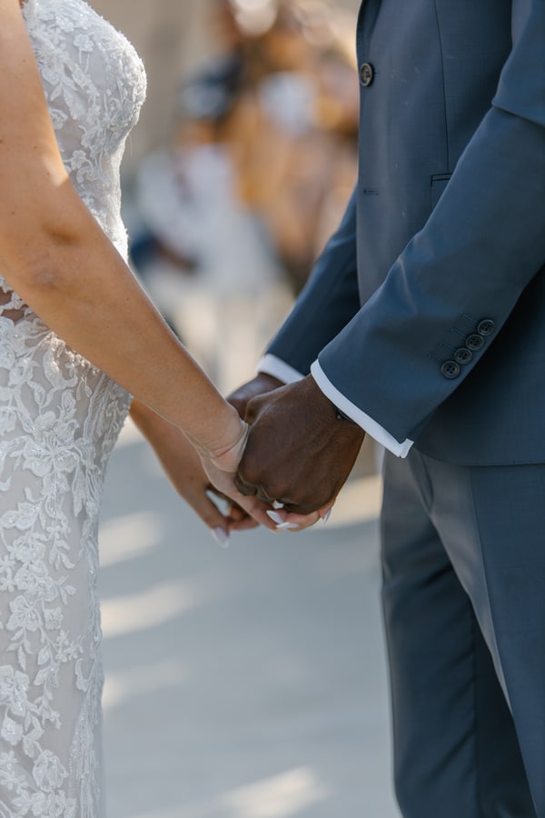 The couple’s hands joined during their wedding ceremony