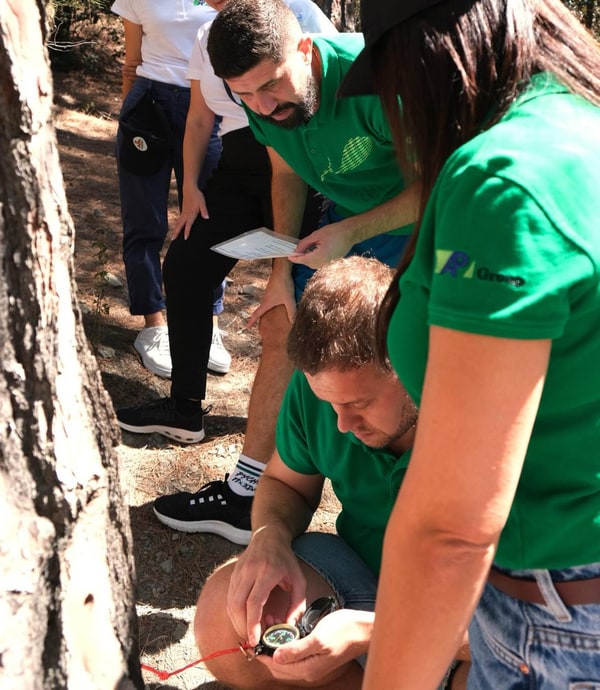 Participants working together on an outdoor team activity