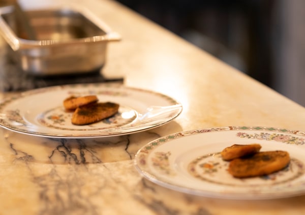 A plated course on patterned dinnerware